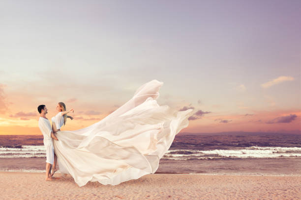 istock Happy couple embracing on the beach 1146756834