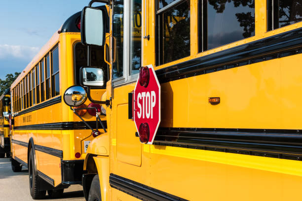 istock Line of school buses waiting to pick up students 1146770377