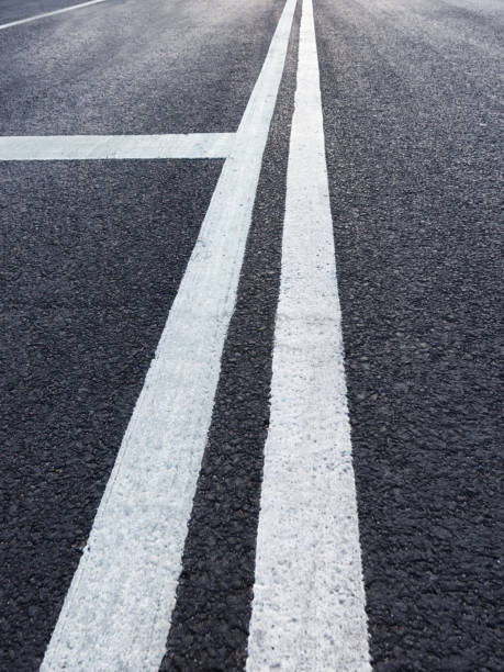 istock Road with white marking diminishing perspective 1146772027