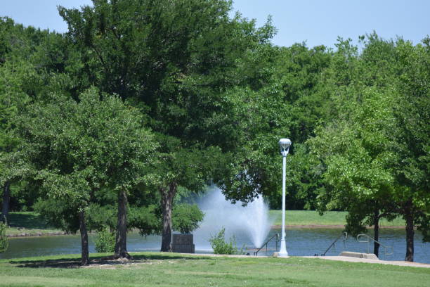 Park with Lake in Frisco, Texas Taken with Nikon D5600. This was taken in Frisco Commons City Park and is a picture of the small lake on the property. frisco texas stock pictures, royalty-free photos & images