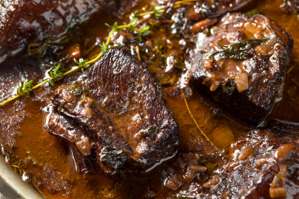 Homemade Braised Beef Short Ribs Homemade Braised Beef Short Ribs with Gravy and Potatoes braised stock pictures, royalty-free photos & images