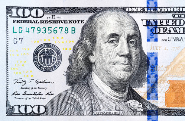 istock Close up part of new hundred dollar bill. 1146773679