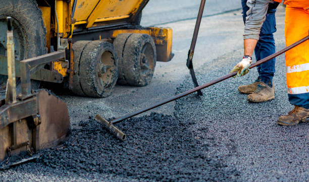 istock Worker regulate tracked paver laying asphalt heated to temperatures above 160 ° pavement on a runway 1146775515