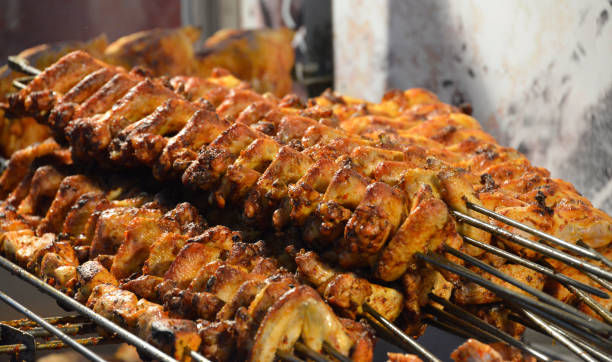 istock Chop baked chicken wings on the spit 1146778128