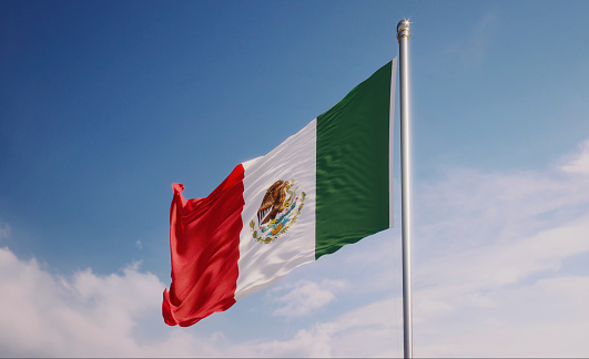 High quality 3d render of a Mexican flag waving with wind over blue sky. Great use for Mexican politics and Mexican culture related concepts.