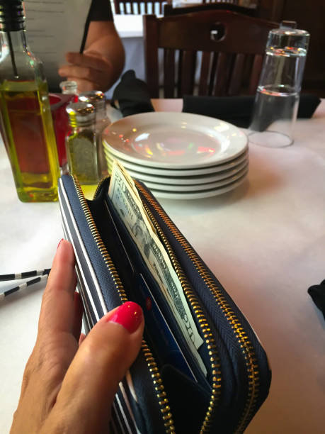 istock Closeup of open wallet in woman’s hand 1146779818