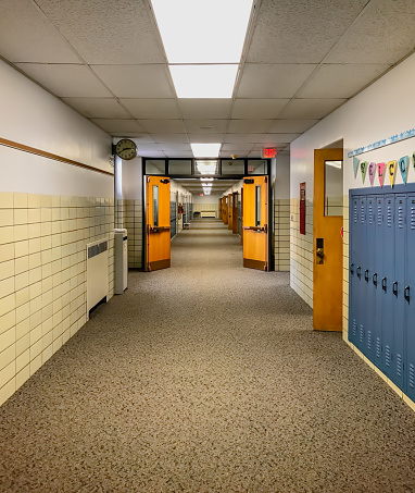 Long empty school hallway ready for students to come back to school