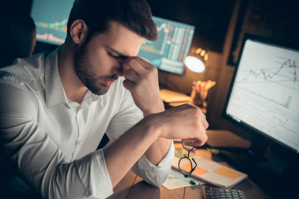 istock Businessman suffering from tired eyes or headache taking off glasses 1146790655