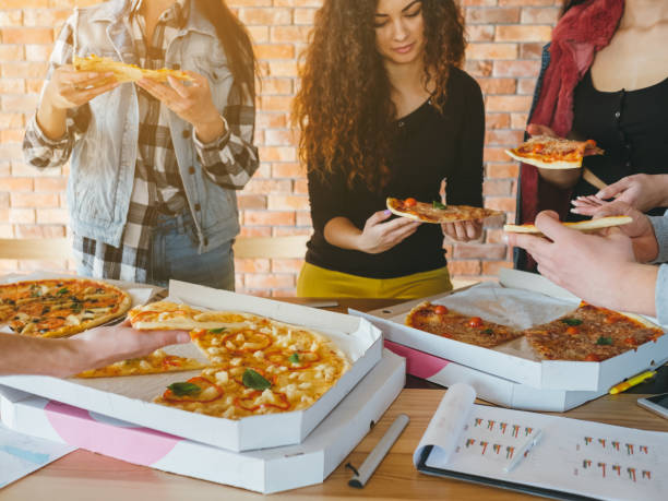 istock business team lunch pizza lifestyle millennials 1146790837