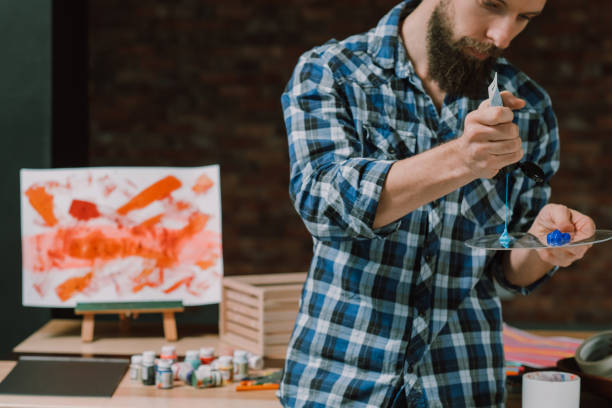 istock artist man artwork paints palette creative idea 1146790950
