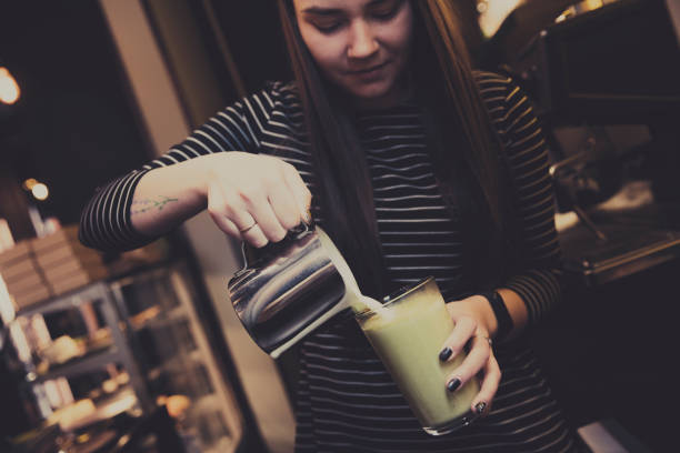 barista is making a coffee