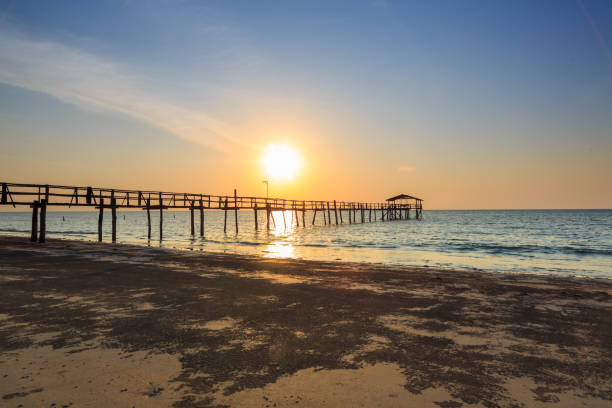 istock Abstract Old wooden jetty pier long exposure during beautiful sunset 1146795052