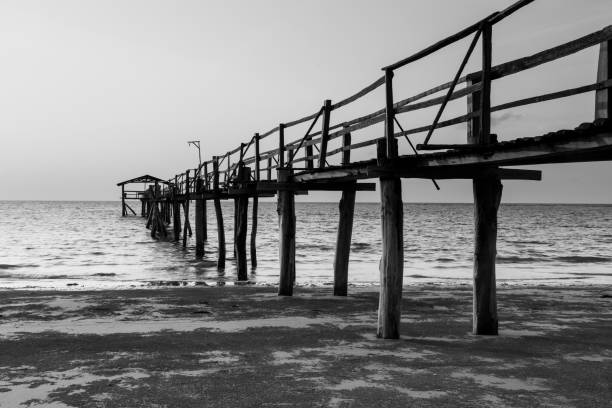 istock Abstract Old wooden jetty pier long exposure during beautiful sunset 1146795061