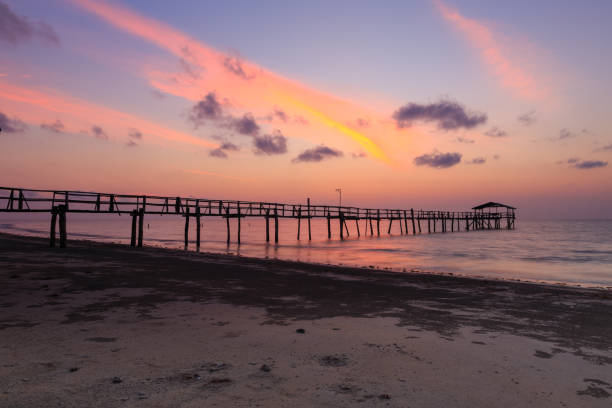 istock Abstract Old wooden jetty pier long exposure during beautiful sunset 1146795082