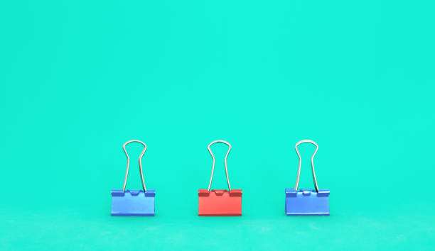 istock Unique, leadership, individuality, and think different concept. Office supplies, one binder paper clip difference with other clips 1146800286
