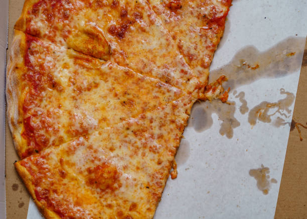 istock A real tasty cheese pizza from a restaurant on cardboard. 1146805019