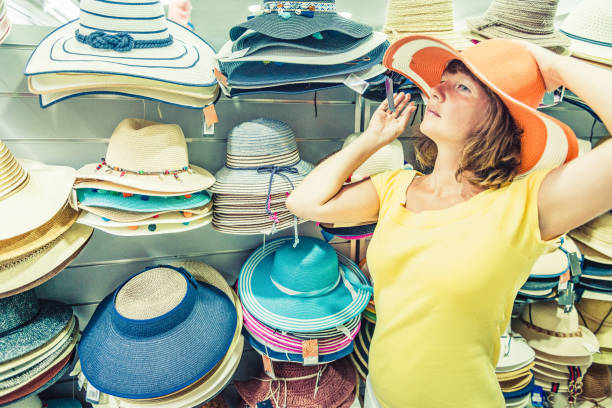 istock woman buying hat 1146806610