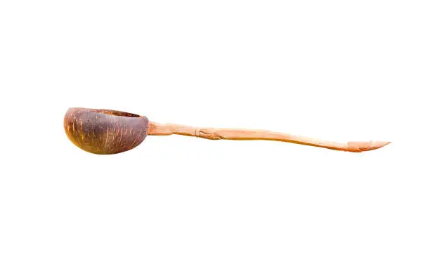 Old dipper water scoop or coconutshell ladle isolated on white background with clipping path , crafts