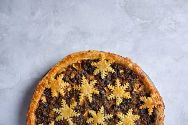 Overhead view of a large whole mince pie with copy space