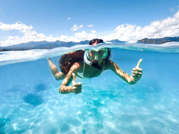 istock Snorkeling woman exploring beautiful ocean. 1146817971