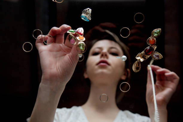 Young woman with jewelry and bijouterie. Low side view