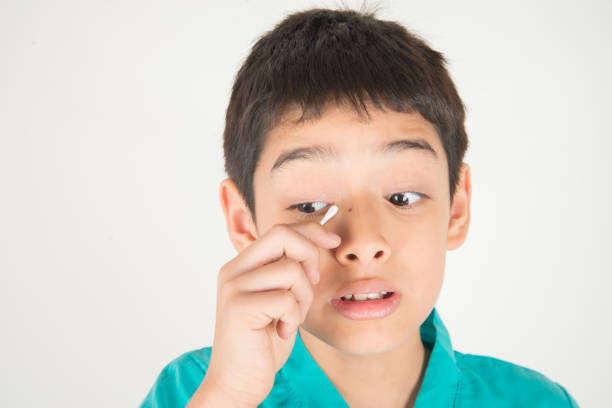 istock Little boy has eyes pain with finger scratch 1146826696