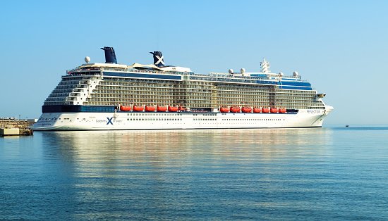 Malaga, Spain - August 05, 2018. Celebrity Reflection cruise ship owned and operated by Celebrity Cruises, docked at the port of Malaga city, Costa del Sol, Malaga Province, Andalucia, Spain