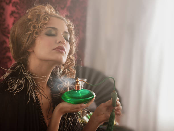 Retro woman applying perfume