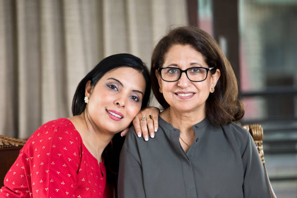 istock Woman embracing senior mother from behind 1146835392