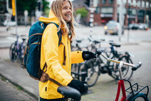 istock Dutch woman with bicycle in Amsterdam 1146835416