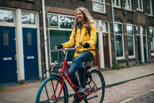 istock Dutch woman with bicycle in Amsterdam 1146835432