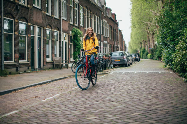 istock Dutch woman with bicycle in Amsterdam 1146835442
