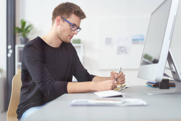istock Confident young businessman wearing eyeglasses 1146839457