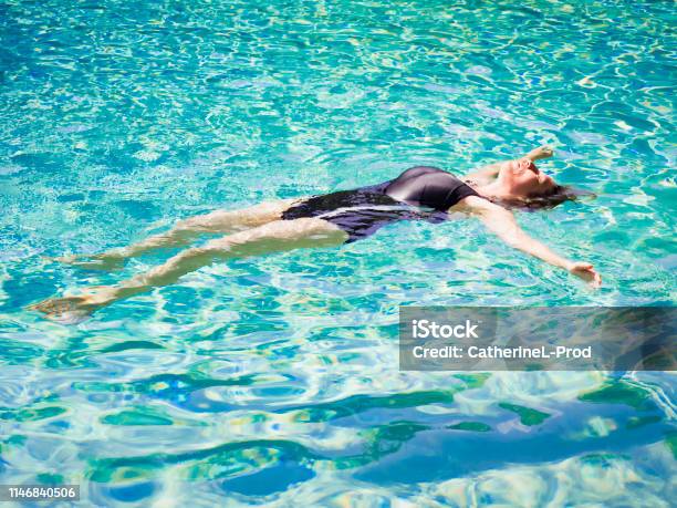 Woman Lying On Clear Water At Tropical Beach Beautiful Mature Girl 