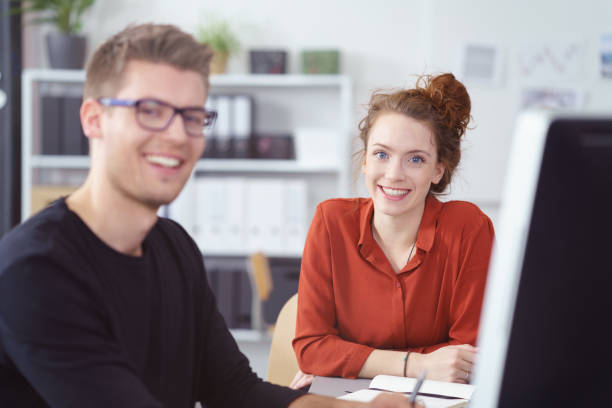 istock Smiling enthusiastic young businesswoman 1146840623