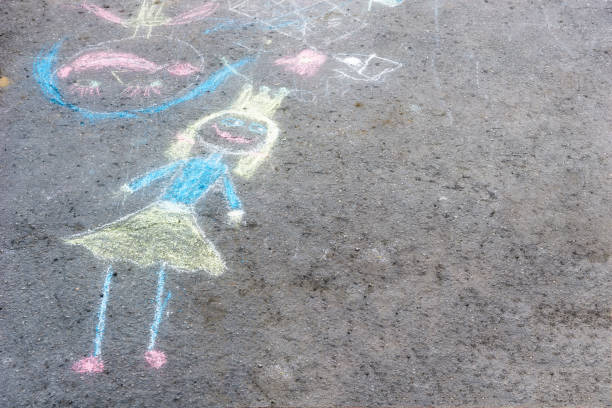 istock Drawing with chaik on asphalt.Draw with your finger. 1146840664