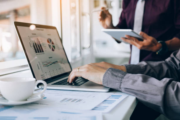istock Two entrepreneur person working and colleague analyzing data for new start-up business and marketing. 1146842441