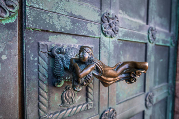 Interesting door handle on main entrance to  Ribe Cathedral, Ribe, Denmark.\nRibe Cathedral is a romanesque church from 1150 AD onwards and inagurated in 1250. \nRibe is the oldest town i Denmark founded 704-710 AD and located on the west coast of Jutland.