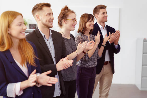 istock Line of diverse businesspeople clapping 1146844732