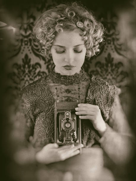 istock Retro woman with vintage camera 1146844933