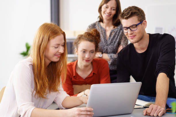 istock Successful young business team around laptop 1146844970
