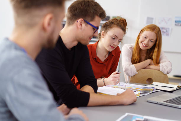 istock Four young business associates discuss work 1146844971