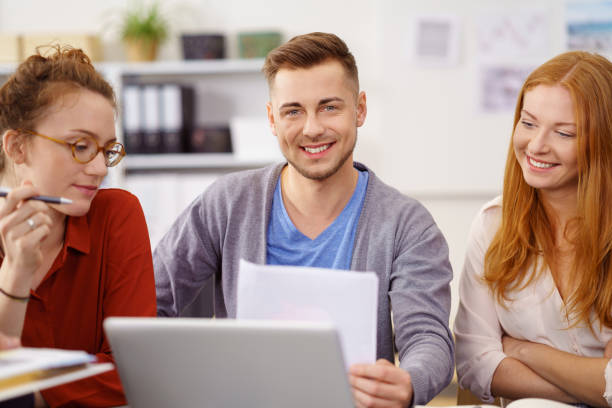 istock Smiling confident young businessman in a meeting 1146845755