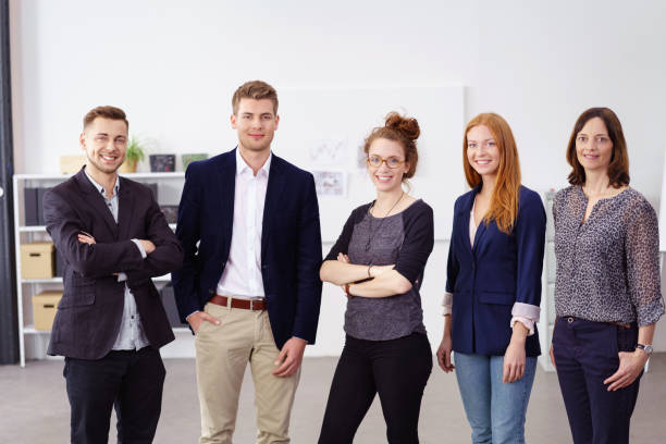 istock Group of five people standing beside each other 1146845945