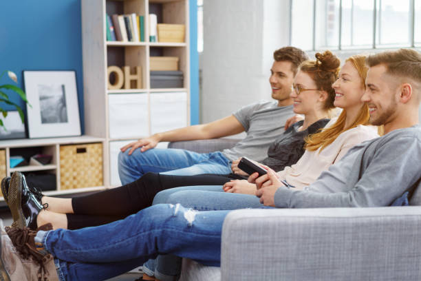 istock Group of friends relaxing watching television 1146846862