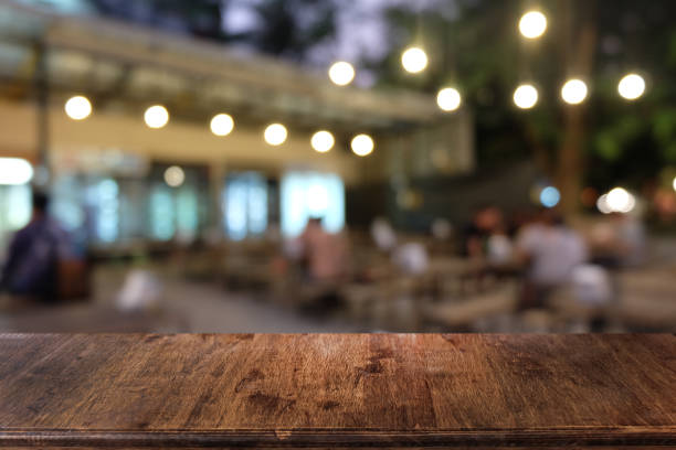 istock Empty dark wooden table in front of abstract blurred bokeh background of restaurant . can be used for display or montage your products.Mock up for space. 1146848100
