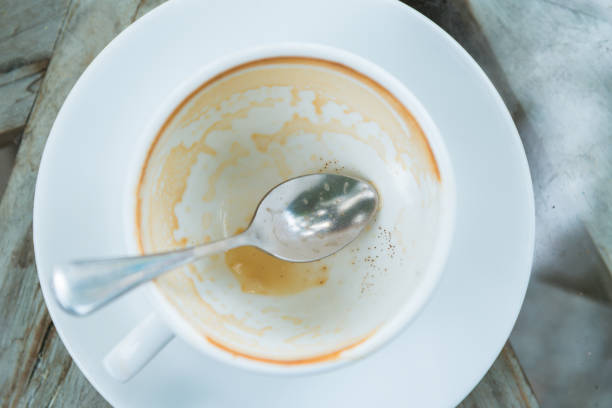 Spill of espresso coffee by accident in the coffee break at office
