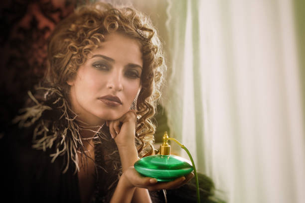 Girl holding a large incandescent lamp in the studio in her hands.