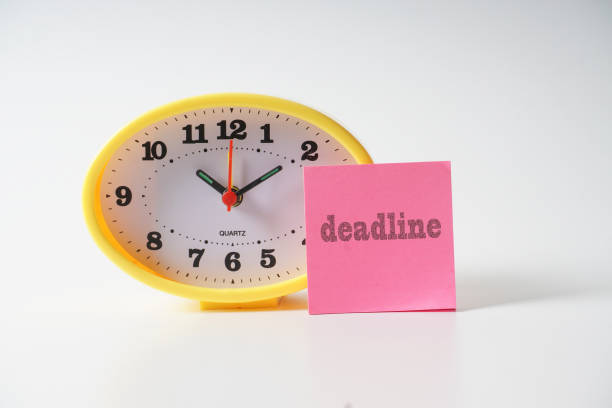 istock Deadline Text And Alarm Clock Against White Background 1146857105