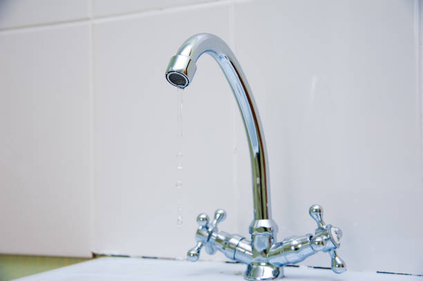 istock Metal faucet in a kitchen 1146858205